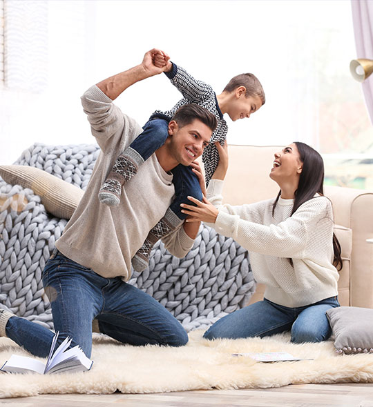 happy family inside comfortable home in winter